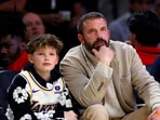 Actor Ben Affleck, right, and his son, left, attend an NBA basketball game between the Los Angeles Lakers and the Golden State Warriors during the first half Thursday, Feb. 6, 2025, in Los Angeles. (AP Photo/Kevork Djansezian)