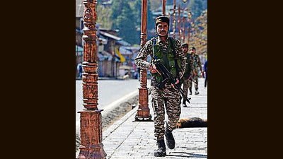 A paramilitary soldier stands guard at a market in Pahalgam on Wednesday. (Waseem Andrabi /HT)