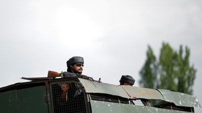An Indian Army soldier looks out from an armoured vehicle on a highway leading to South Kashmir's Pahalgam on April 23, 2025. (REUTERS)