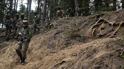 Soldiers trek back after a search operation around Baisaran meadow in the aftermath of an attack in Pahalgam. (AFP)