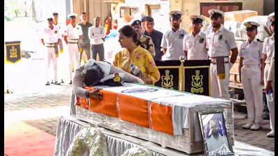 Indian Navy Lt. Vinay Narwal's wife breaks down while paying tribute to her husband after his mortal remains were brought at the cargo terminal of IGI Airport, in New Delhi on Wednesday. (PTI) Indian Navy Lt. Vinay Narwal's wife breaks down while paying tribute to her husband after his mortal remains were brought at the cargo terminal of IGI Airport, in New Delhi on Wednesday. (PTI)