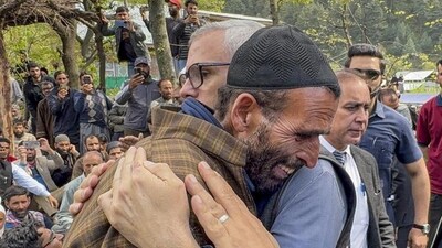 Jammu and Kashmir chief minister Omar Abdullah consoling the father of Syed Adil Hussain Shah, a pony ride operator who was killed in the terrorist attack in Pahalgam on Tuesday, in Anantnag district on Wednesday. (HT_PRINT) Jammu and Kashmir chief minister Omar Abdullah consoling the father of Syed Adil Hussain Shah, a pony ride operator who was killed in the terrorist attack in Pahalgam on Tuesday, in Anantnag district on Wednesday. (HT_PRINT)