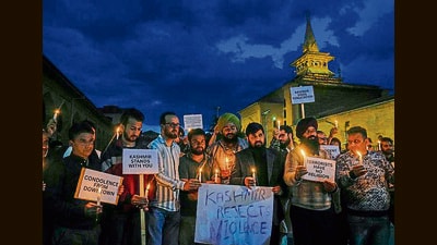 People hold a candlelight vigil to pay tribute to the victims of the Pahalgam terror attack, outside Jamia Masjid Nowhatta in downtown Srinagar on Wednesday. (PTI) People hold a candlelight vigil to pay tribute to the victims of the Pahalgam terror attack, outside Jamia Masjid Nowhatta in downtown Srinagar on Wednesday. (PTI)