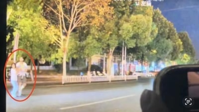 A family moments before being killed in a rage-fueled road accident. (Screengrab (Rednote))