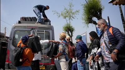 Tourists getting their belongings loaded on a vehicle as they leave for Srinagar airport on Wednesday, a day after the terror attack on visitors in Pahalgam. (Reuters) Tourists getting their belongings loaded on a vehicle as they leave for Srinagar airport on Wednesday, a day after the terror attack on visitors in Pahalgam. (Reuters)