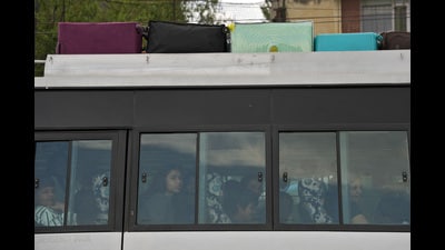 Tourists sit in tempo as they head towards the airport, following a suspected militant attack near south Kashmir's Pahalgam, in Srinagar. (REUTERS) Tourists sit in tempo as they head towards the airport, following a suspected militant attack near south Kashmir's Pahalgam, in Srinagar. (REUTERS)