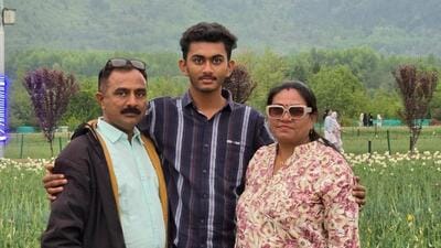 Yatishbhai Parmar (left), his wife Kajalben Parmar (right), and their son Smit Parmar (centre) .