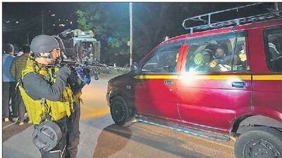 Security personnel check a vehicle near Pahalgam on Tuesday. (AP) Security personnel check a vehicle near Pahalgam on Tuesday. (AP)