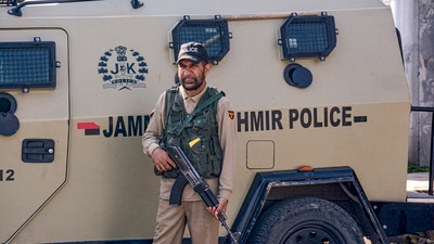 A security personnel stands guard in a closed market during a strike call given by traders, transporters and other several organisations against the Pahalgam terror attacks in which 26 tourists were killed. (PTI) A security personnel stands guard in a closed market during a strike call given by traders, transporters and other several organisations against the Pahalgam terror attacks in which 26 tourists were killed. (PTI)