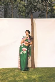 Saree: Navyasa created by LIVA | Jewellery: Shri Paramani Jewels | Palak is draped to perfection in a green floral printed satin saree from Navyasa created by LIVA. The saree’s delicate pink floral prints create a look that’s equal parts refreshing and sophisticated. Her look is rounded off with big polki earrings, bordered with small pearl and diamonds. (Photo: Siddharth Jaiswar) Saree: Navyasa created by LIVA | Jewellery: Shri Paramani Jewels | Palak is draped to perfection in a green floral printed satin saree from Navyasa created by LIVA. The saree’s delicate pink floral prints create a look that’s equal parts refreshing and sophisticated. Her look is rounded off with big polki earrings, bordered with small pearl and diamonds. (Photo: Siddharth Jaiswar)