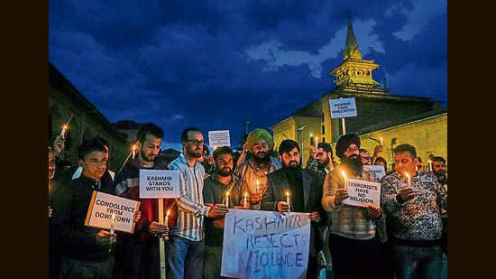 People hold a candlelight vigil to pay tribute to the victims of the Pahalgam terror attack, outside Jamia Masjid Nowhatta in downtown Srinagar on Wednesday. (PTI)