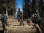 Security force personnel stand guard at the site of the terror attack on tourists in Baisaran near Pahalgam.