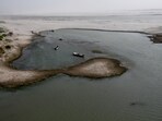 View of boats in the water on the dry riverbed of the Indus River in Hyderabad, Pakistan April 24, 2025.