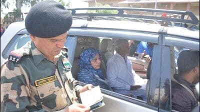 A BSF personnel checking the passport of Pakistani national Mehnaz Begum as she returns to her country from the Attari Integrated Check Post (ICP) on Thursday. (Sameer Sehgal/HT) A BSF personnel checking the passport of Pakistani national Mehnaz Begum as she returns to her country from the Attari Integrated Check Post (ICP) on Thursday. (Sameer Sehgal/HT)