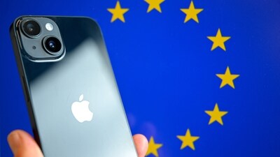 This photograph shows a hand-held smartphone with the Apple company logo and the European Union logo in the background, (AFP) This photograph shows a hand-held smartphone with the Apple company logo and the European Union logo in the background, (AFP)
