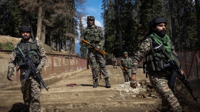 Security force personnel stand guard at the site of the terror attack on tourists in Baisaran near Pahalgam. (Reuters)