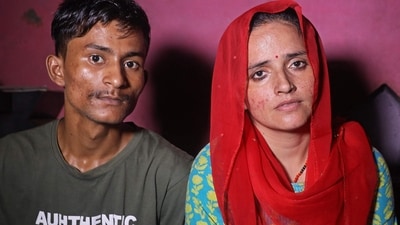 Sachin Meena (L) and Seema Haider attend an interview with AFP at their residence in Greater Noida. (AFP)