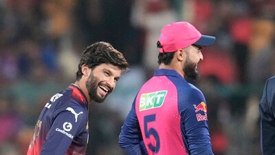 Rajat Patidar and Riyan Parag share a laugh at the toss, as Patidar's streak of losing coin tosses at home continues, now four in a row. (AP) Rajat Patidar and Riyan Parag share a laugh at the toss, as Patidar's streak of losing coin tosses at home continues, now four in a row. (AP)