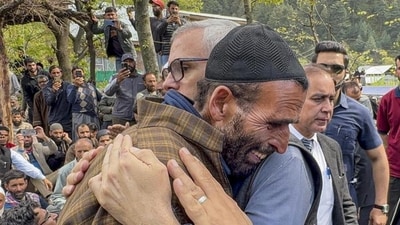 Jammu and Kashmir chief minister Omar Abdullah consoling the father of Syed Adil Hussain Shah, a pony ride operator who was killed in the terrorist attack in Pahalgam on Tuesday, in Anantnag district on Wednesday. (PTI) Jammu and Kashmir chief minister Omar Abdullah consoling the father of Syed Adil Hussain Shah, a pony ride operator who was killed in the terrorist attack in Pahalgam on Tuesday, in Anantnag district on Wednesday. (PTI)