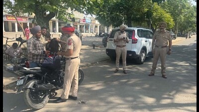 Police conducting a drive to combat the menace of eve-teasing near schools and colleges in Ludhiana on Thursday. (HT photo)