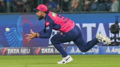 Riyan Parag tries to catch the ball (PTI) Riyan Parag tries to catch the ball (PTI)