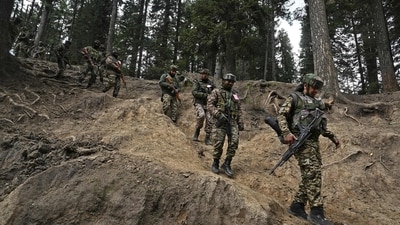 Indian soldiers trek back after a search operation around Baisaran meadow in the aftermath of an attack in Pahalgam. (AFP) Indian soldiers trek back after a search operation around Baisaran meadow in the aftermath of an attack in Pahalgam. (AFP)