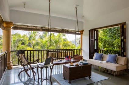 Add a swing and also an armchair to your balcony. (Picture credit: Booking.com)