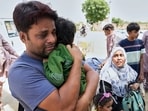 An Indian citizen with his children and his Pakistani wife, who were visiting Pakistan, wait for clearance to cross the border through Wagah, a joint border crossing point on the Pakistan and India border, near Lahore, Pakistan, Friday, April 25, 2025. An Indian citizen with his children and his Pakistani wife, who were visiting Pakistan, wait for clearance to cross the border through Wagah, a joint border crossing point on the Pakistan and India border, near Lahore, Pakistan, Friday, April 25, 2025.