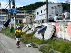 A man walks in front of a damaged wall after the earthquake that struck the city of Esmeraldas, Ecuador on April 25, 2025. A man walks in front of a damaged wall after the earthquake that struck the city of Esmeraldas, Ecuador on April 25, 2025.