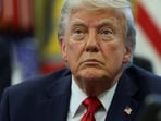 U.S. President Donald Trump looks on, as he signs executive orders in the Oval Office at the White House in Washington, D.C., U.S., April 23, 2025.