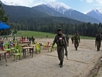 Security personnel inspect the site in the aftermath of the terror attack as food stall chairs lie empty in Pahalgam on April 23. Security personnel inspect the site in the aftermath of the terror attack as food stall chairs lie empty in Pahalgam on April 23.