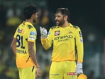 Chennai Super Kings' captain Mahendra Singh Dhoni, right, speaks to teammate Matheesha Pathirana