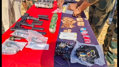 Acting on information from BSF’s intelligence wing, troops launched a search operation and uncovered two large concealed packets from an agricultural field. The haul includes 5 hand grenades with 6 detonators, 4 pistols with 8 magazines, 220 live rounds, 4.845 kg high explosive with IED circuits, remote-controlled devices, multiple types of batteries, as per the spokesperson. (PTI)