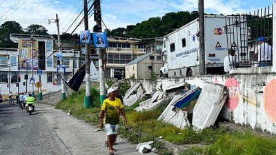 A man walks in front of a damaged wall after the earthquake that struck the city of Esmeraldas, Ecuador on April 25, 2025. (AFP)