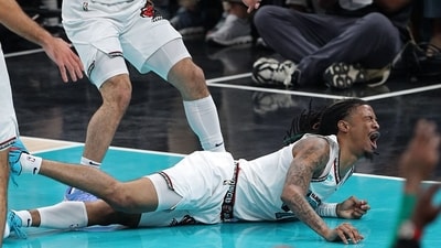 Ja Morant #12 of the Memphis Grizzlies reacts after falling to the court during the first half against the Oklahoma City Thunder (Getty Images via AFP) Ja Morant #12 of the Memphis Grizzlies reacts after falling to the court during the first half against the Oklahoma City Thunder (Getty Images via AFP)