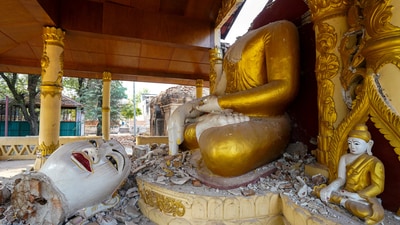 A broken Buddha statue is pictured inside a damaged pagoda following one of two strong earthquakes in Myanmar (REUTERS)