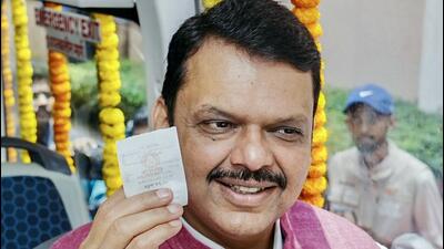 Maharashtra Chief Minister Devendra Fadnavis takes a ride in the BEST's electric AC bus service after its inauguration, in Mumbai on Friday. (CMO Maharashtra - X) Maharashtra Chief Minister Devendra Fadnavis takes a ride in the BEST's electric AC bus service after its inauguration, in Mumbai on Friday. (CMO Maharashtra - X)