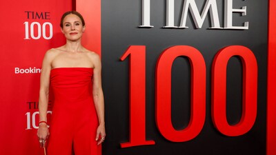 Kristen Bell attended the 2025 TIME100 Gala wearing a stunning red strapless suit. The Nobody Wants This star paired her strapless jumpsuit by Carolina Herrera with a matching bag. (REUTERS)