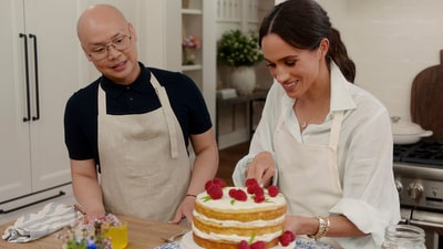 This image released by Netflix shows Daniel Martin, left, and Meghan, Duchess of Sussex, in a scene from "With Love, Meghan." (Netflix via AP) (AP) This image released by Netflix shows Daniel Martin, left, and Meghan, Duchess of Sussex, in a scene from "With Love, Meghan." (Netflix via AP) (AP)