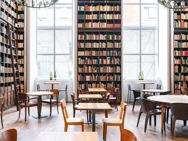 Striking interiors of the B2 hotel include an 11-metre-high library filled with 33,000 books and chandeliers created from original Hürlimann beer bottles.