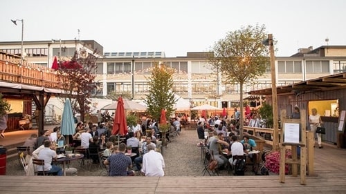 Enjoy grilled delicacies and refreshing drinks in the charming garden setting of Binz & Kunz.