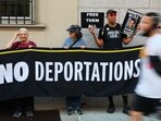 Demonstrators gather to protest against the deportation of immigrants to El Salvador. Demonstrators gather to protest against the deportation of immigrants to El Salvador.