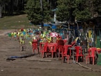 Chairs and tables are scattered at the site of a suspected militant attack on tourists in Baisaran near Pahalgam in south Kashmir's Anantnag district, April 24, 2025. 