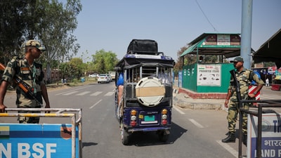 Border Security Force (BSF) soldiers stand guard as a vehicle with Pakistani citizens crosses towards the integrated checkpost as they prepare to leave India after India revoked all visas issued to Pakistani citizens, at the Attari-Wagah border crossing near Amritsar, India, April 26, 2025. (REUTERS)
