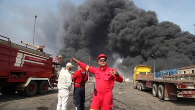 Firefighters work as black smoke rises in the sky after a massive explosion rocked a port near the southern city of Bandar Abbas, Iran, Saturday, April 26, 2025. (AP) Firefighters work as black smoke rises in the sky after a massive explosion rocked a port near the southern city of Bandar Abbas, Iran, Saturday, April 26, 2025. (AP)
