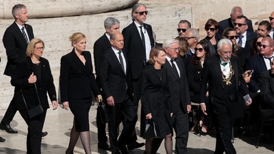 Germany's President Frank-Walter Steinmeier can be seen with his wife Elke Buedenbender, and Germany's Chancellor Olaf Scholz walk, on the day of the funeral Mass of Pope Francis, at the Vatican, April 26, 2025. (REUTERS)