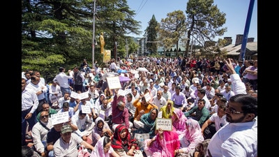 Primary teachers raise slogans during a protest in Shimla, on Saturday. (PTI) Primary teachers raise slogans during a protest in Shimla, on Saturday. (PTI)