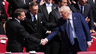 President Donald Trump, right, shakes hands with French President Emmanuel Macron, left, as Finland's President Alexander Stubb, looks on, as they attend the funeral of Pope Francis in St. Peter's Square at the Vatican, Saturday, April 26, 2025. (AP Photo/Evan Vucci) (AP) President Donald Trump, right, shakes hands with French President Emmanuel Macron, left, as Finland's President Alexander Stubb, looks on, as they attend the funeral of Pope Francis in St. Peter's Square at the Vatican, Saturday, April 26, 2025. (AP Photo/Evan Vucci) (AP)