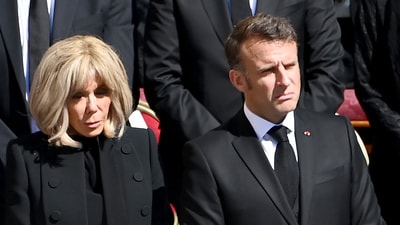 France's President Emmanuel Macron (R) and his wife Brigitte Macron arrived at late Pope Francis' funeral ceremony at St Peter's Square in The Vatican on April 26, 2025. (Photo by Isabella BONOTTO / AFP) (AFP) France's President Emmanuel Macron (R) and his wife Brigitte Macron arrived at late Pope Francis' funeral ceremony at St Peter's Square in The Vatican on April 26, 2025. (Photo by Isabella BONOTTO / AFP) (AFP)