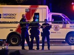 An ambulance is parked at the site of the Lapu Lapu day block party, where a vehicle drove into a crowd killing several people in Vancouver.